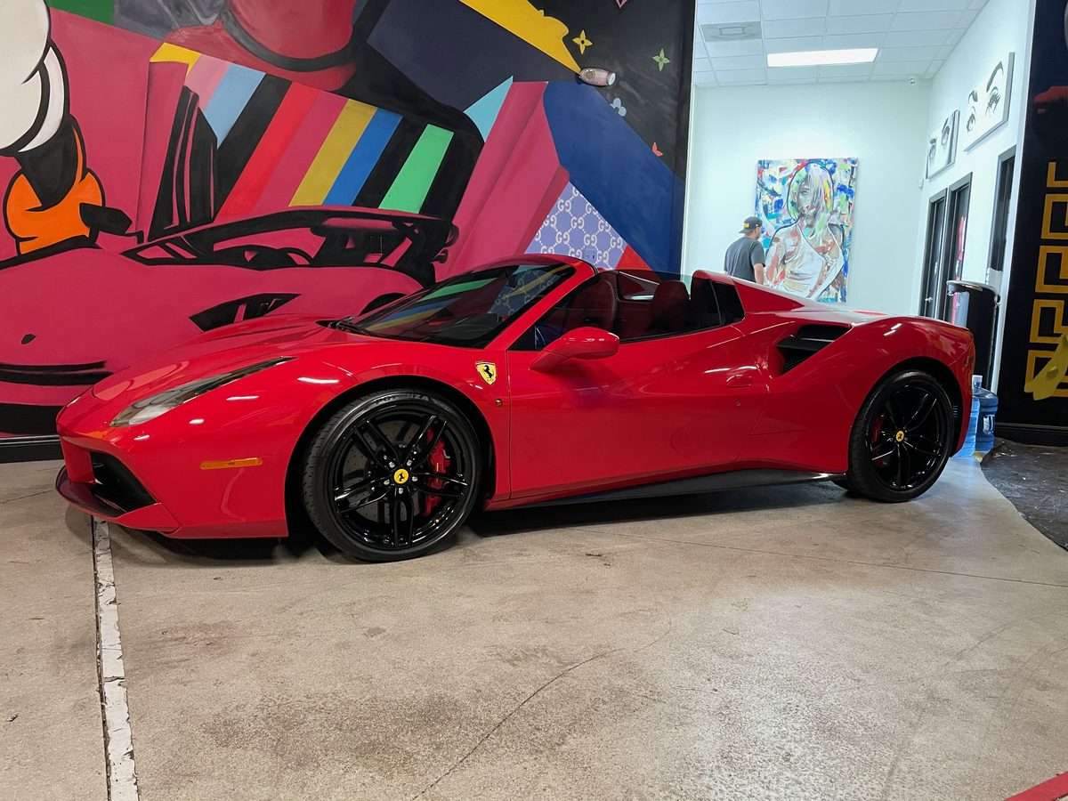 Red Ferrari 488 Spider with window tint in South Florida